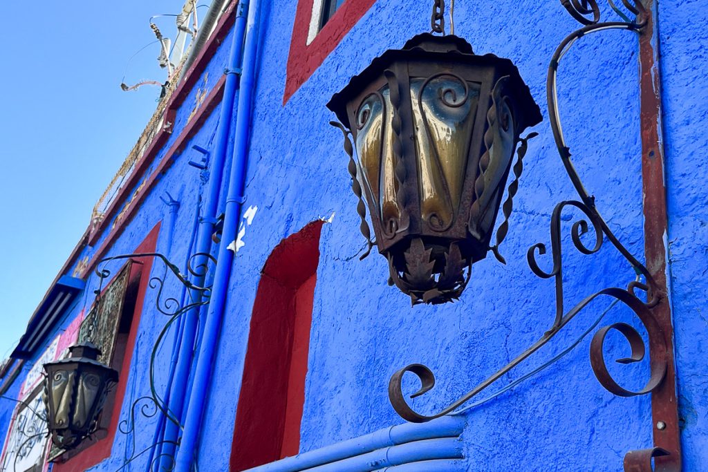 traditional mexican lantern and wrought iron details on colourfu