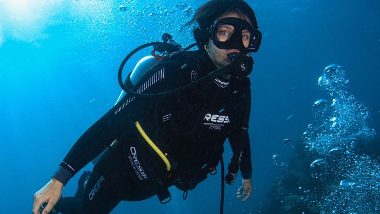 female scuba diver swimming underwater