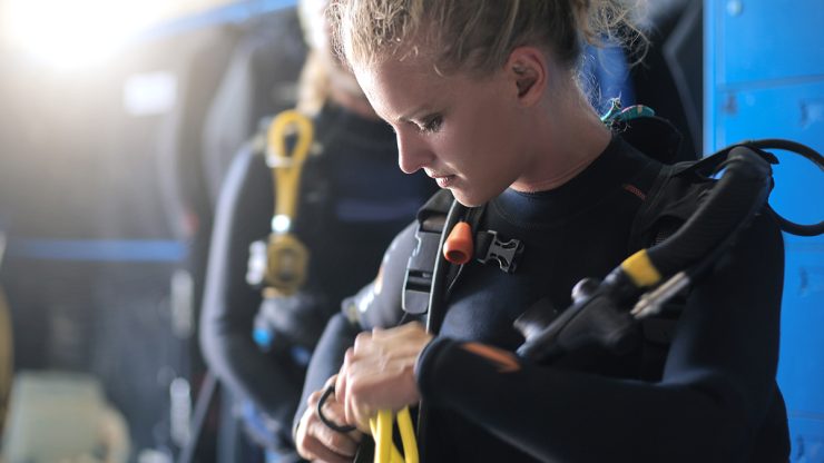 women preparing for scuba diving